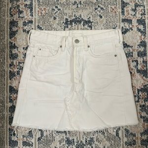 White denim skirt with silver buttons and tattered hemming